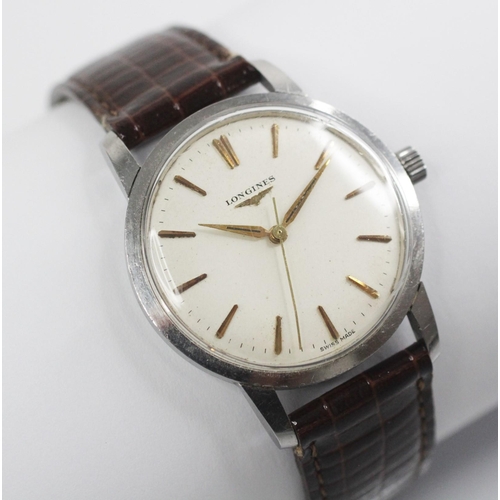 76 - A gentleman's Longines automatic wristwatch, round cream dial with gold coloured baton markers, set ... 