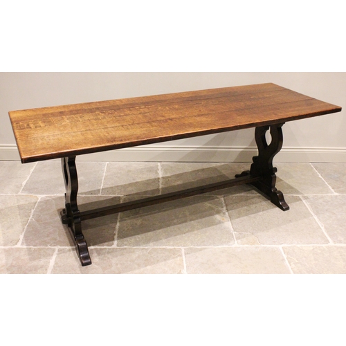 817 - A 17th century style oak refectory table, early 20th century, the rectangular top raised upon two pi... 