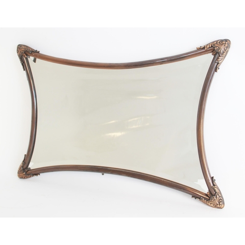 677 - An Art Nouveau style wall mirror, the copper effect shaped tubular frame with with cast acanthus lea... 