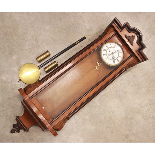 687 - A Victorian Vienna twin weight wall clock, the walnut and ebonised case enclosing the 19cm white ena... 