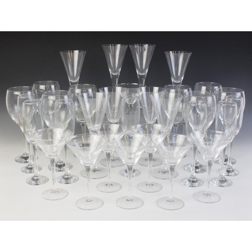 592 - An assorted collection of stem glasses, comprising eight red wine glasses, eight martini glasses, a ... 