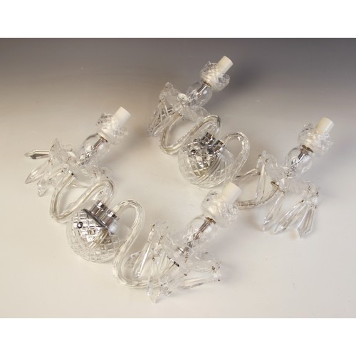 607 - A pair of French glass two branch wall light fittings, early 20th century, each formed as two 'S' sh... 