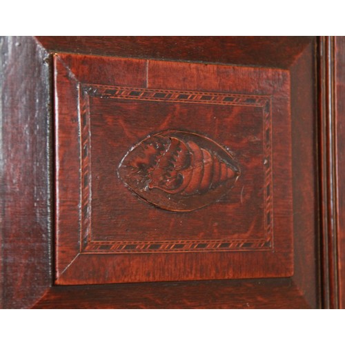 732 - A George III oak and mahogany cross banded freestanding corner cupboard, the moulded cornice above a... 