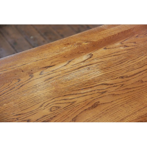 820 - An oak draw leaf refectory table by Willis and Gambier, late 20th century, the cleated slab top with... 