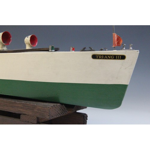 670 - A Tri-Ang clockwork speed boat, early 20th century circa 1930, the wooden hull painted in green and ... 