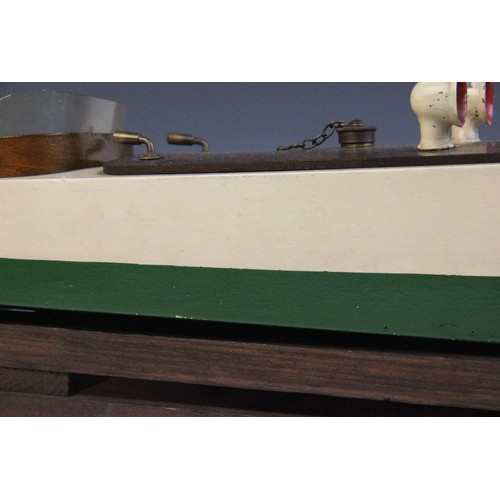 670 - A Tri-Ang clockwork speed boat, early 20th century circa 1930, the wooden hull painted in green and ... 