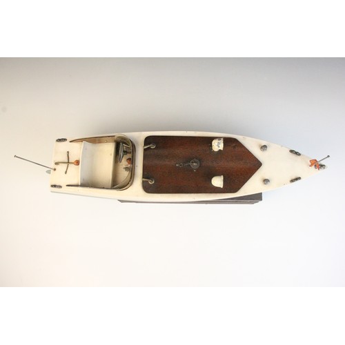 670 - A Tri-Ang clockwork speed boat, early 20th century circa 1930, the wooden hull painted in green and ... 