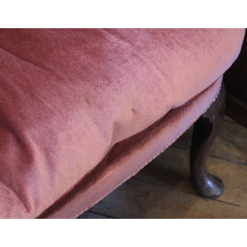 729 - A George III wing back fireside armchair, later re-covered in pink velour with applied rope detail, ... 