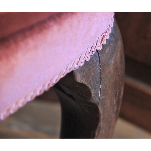 729 - A George III wing back fireside armchair, later re-covered in pink velour with applied rope detail, ... 