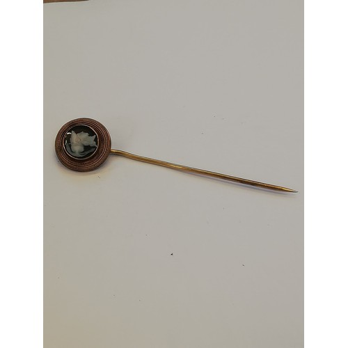 115 - A selection of stick pins and accessories, to include a carved hardstone cameo stick pin, depicting ... 