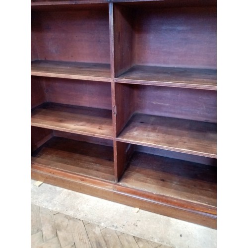 735 - A large Regency mahogany library bookcase, the cavetto cornice above a plain frieze and a pair of qu... 