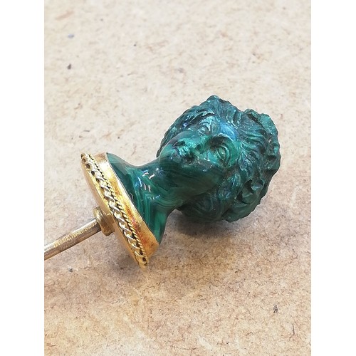 116 - A malachite stick pin, carved in the classical style as a female head with waved hair and a crown of... 