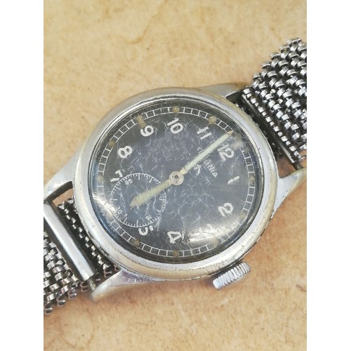 75 - A Second World War British Military Issue Lemania W.W.W manual wristwatch, the circular black dial b... 