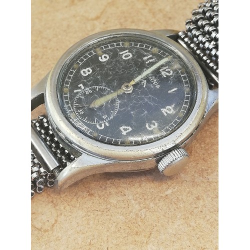 75 - A Second World War British Military Issue Lemania W.W.W manual wristwatch, the circular black dial b... 