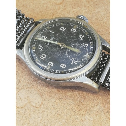 75 - A Second World War British Military Issue Lemania W.W.W manual wristwatch, the circular black dial b... 