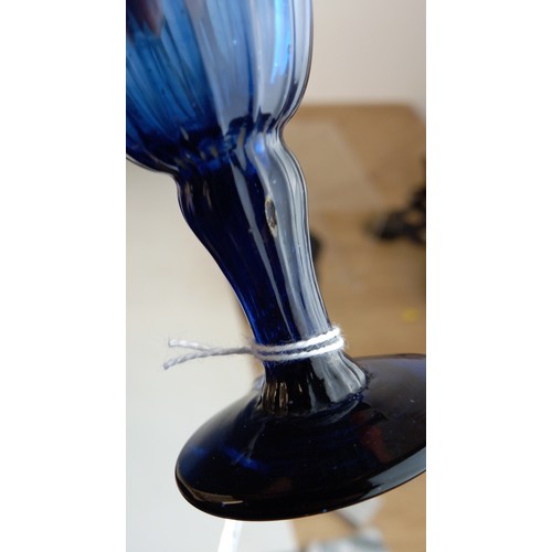 588 - A Bristol blue glass beaker, the wrythen body of tapering form, unpolished pontil, 10cm high, with a... 