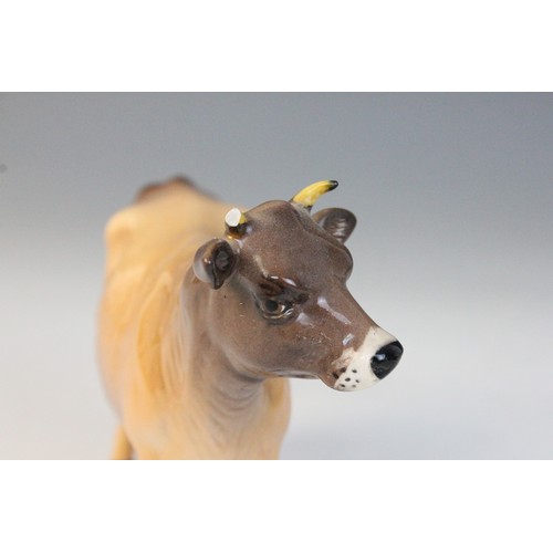 563 - Two Beswick cattle families, comprising: a Jersey Bull, model No. 1422 in gloss, 