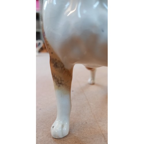 554 - A collection of Beswick dogs, to include a seated bulldog, model No. 1872, 12.2cm high, a boxer dog ... 