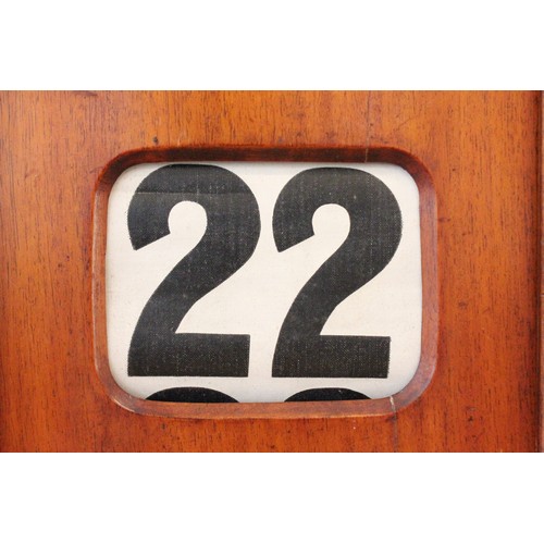 628 - An early 20th century walnut cased perpetual roller desk calendar, of architectural form, the roller... 