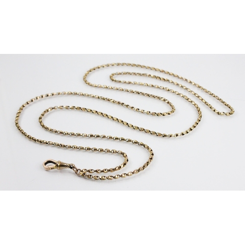 105 - A Victorian gold coloured guard chain, applied pad stamped '9C', with gold coloured lobster claw lin... 