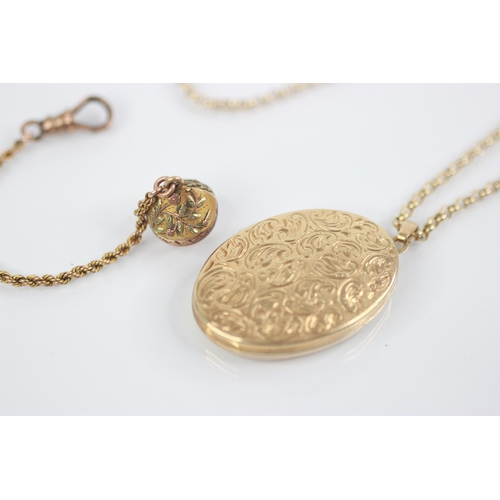 106 - A 9ct locket pendant, of oval form with scrolling foliate decoration to cover, two transparent apert... 