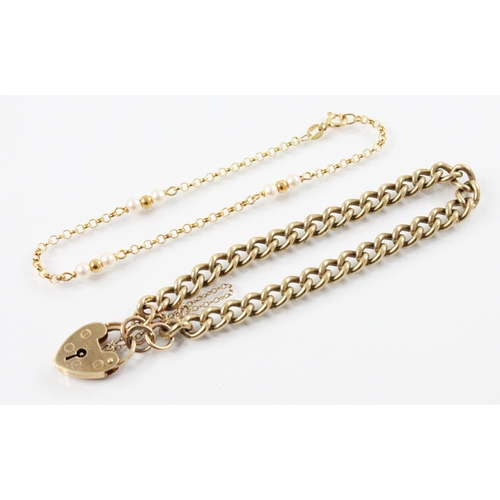 112 - A 9ct gold curb link bracelet, 18cm long, with a 9ct gold heart-shaped padlock fastener, 19mm x 14mm... 