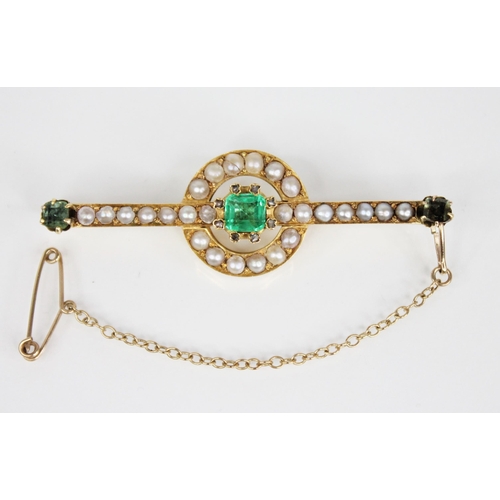 121 - A Victorian emerald, pearl and diamond brooch, the central rectangular step cut emerald measuring 5.... 