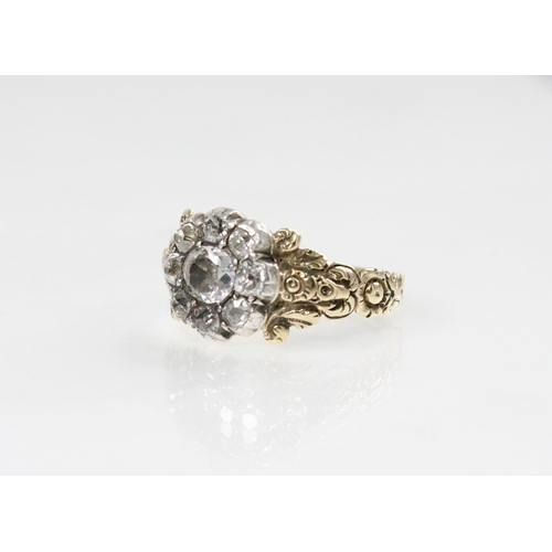 123 - A 19th century diamond floral cluster ring, comprising a central oval old cut diamond measuring 5.3m... 