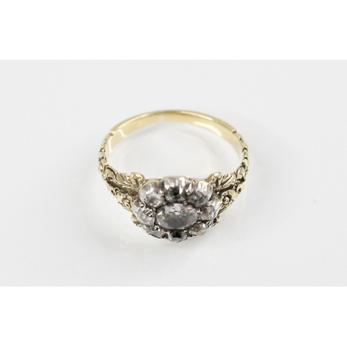 123 - A 19th century diamond floral cluster ring, comprising a central oval old cut diamond measuring 5.3m... 