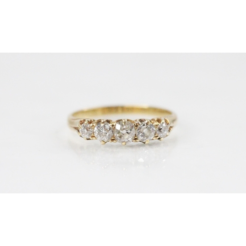 125 - A Victorian five-stone diamond ring, comprising five graduated old cut diamonds, the central diamond... 