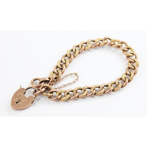 127 - A 9ct gold curb-link bracelet, designed as alternating plain polished and patterned links, 18cm long... 