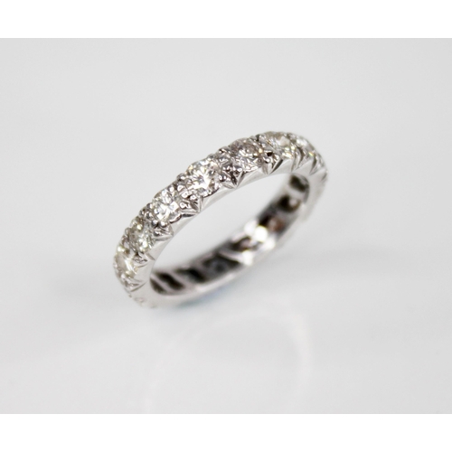 130 - A diamond eternity ring, comprising seventeen round brilliant cut diamonds, each weighing approximat... 