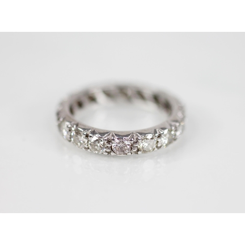 130 - A diamond eternity ring, comprising seventeen round brilliant cut diamonds, each weighing approximat... 