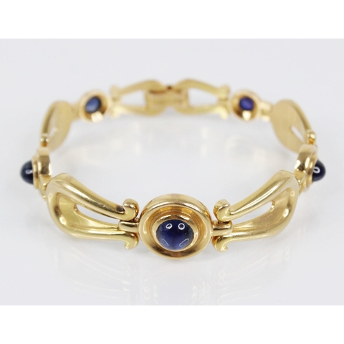 131 - A Swedish 18ct gold sapphire set bracelet by Hugo Stromdahl, designed as alternating circular and ly... 