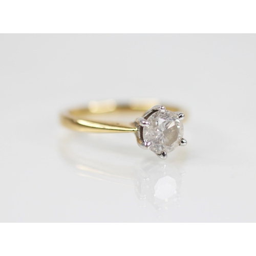 138 - A diamond solitaire ring, the central round brilliant cut diamond weighing 1.09 carats, claw set in ... 