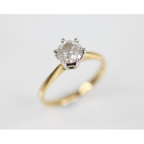 138 - A diamond solitaire ring, the central round brilliant cut diamond weighing 1.09 carats, claw set in ... 