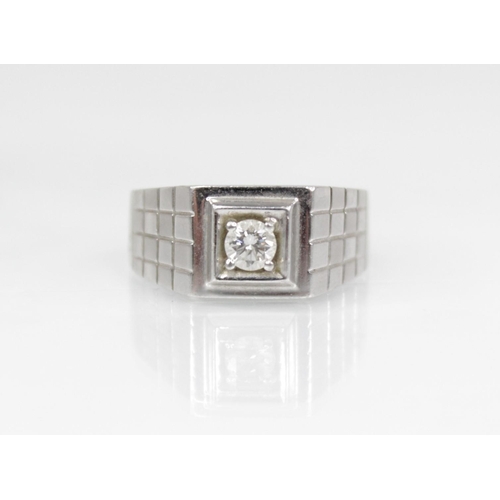 140 - A platinum and diamond ring, the central round brilliant cut diamond weighing approximately 0.20 car... 