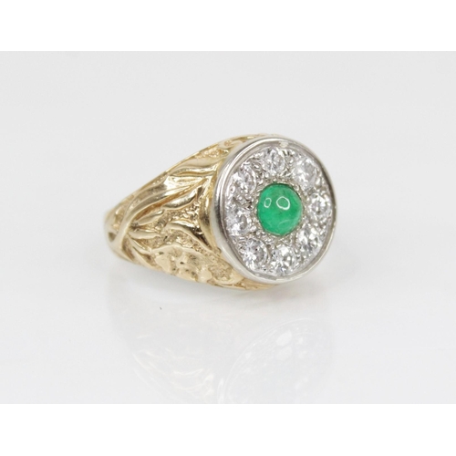 141 - An emerald and diamond 14ct gold target ring, the central circular cluster designed as a circular em... 