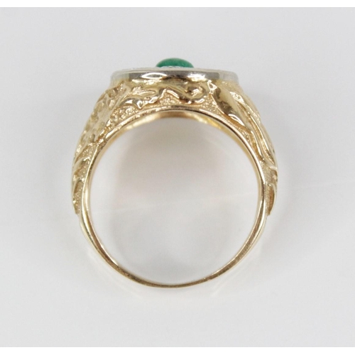 141 - An emerald and diamond 14ct gold target ring, the central circular cluster designed as a circular em... 