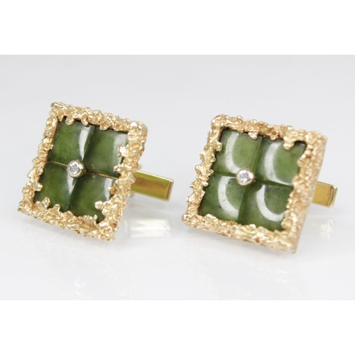 143 - A pair of jadeite, diamond and gold coloured cufflinks, each of square form set with nephrite jade p... 