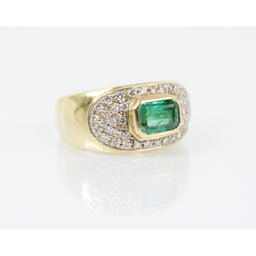 154 - An Italian emerald and diamond 18ct gold ring, designed as a central rectangular step cut emerald me... 