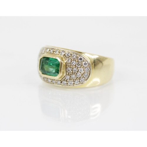 154 - An Italian emerald and diamond 18ct gold ring, designed as a central rectangular step cut emerald me... 