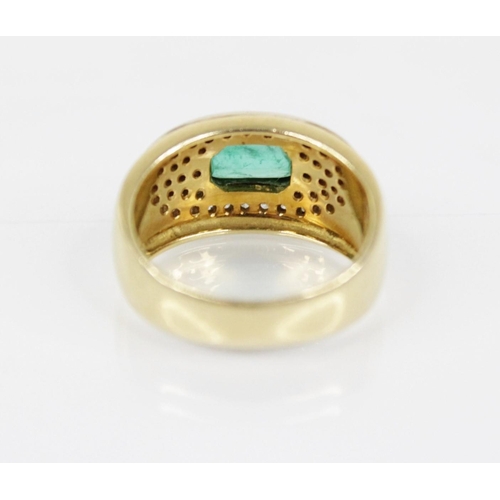 154 - An Italian emerald and diamond 18ct gold ring, designed as a central rectangular step cut emerald me... 