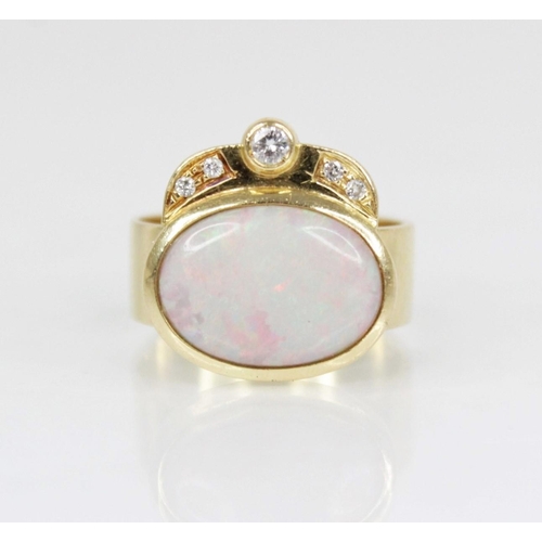 155 - An Italian opal and diamond 18ct gold ring, the central oval opal cabochon measuring 13.5mm x 10mm, ... 