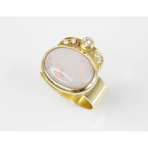 155 - An Italian opal and diamond 18ct gold ring, the central oval opal cabochon measuring 13.5mm x 10mm, ... 