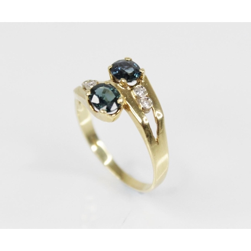 158 - A continental sapphire and diamond 18ct gold crossover ring, designed as two oval mixed cut sapphire... 