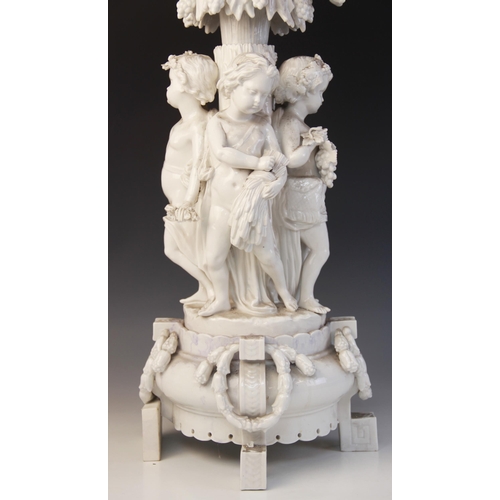 390 - A Paris porcelain white glazed table centre of large proportions, early 19th century, the central pi... 