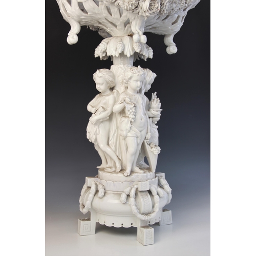 390 - A Paris porcelain white glazed table centre of large proportions, early 19th century, the central pi... 