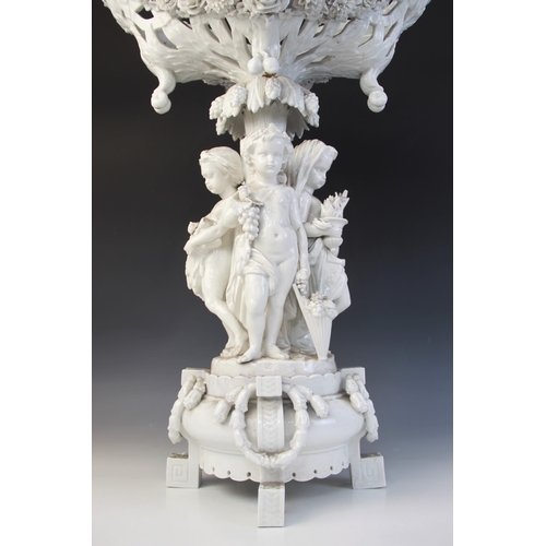 390 - A Paris porcelain white glazed table centre of large proportions, early 19th century, the central pi... 