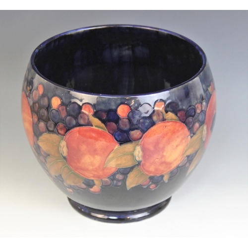 397 - A Moorcroft ovoid vase in the Pomegranate pattern on cobalt blue ground, early 20th century, green p... 